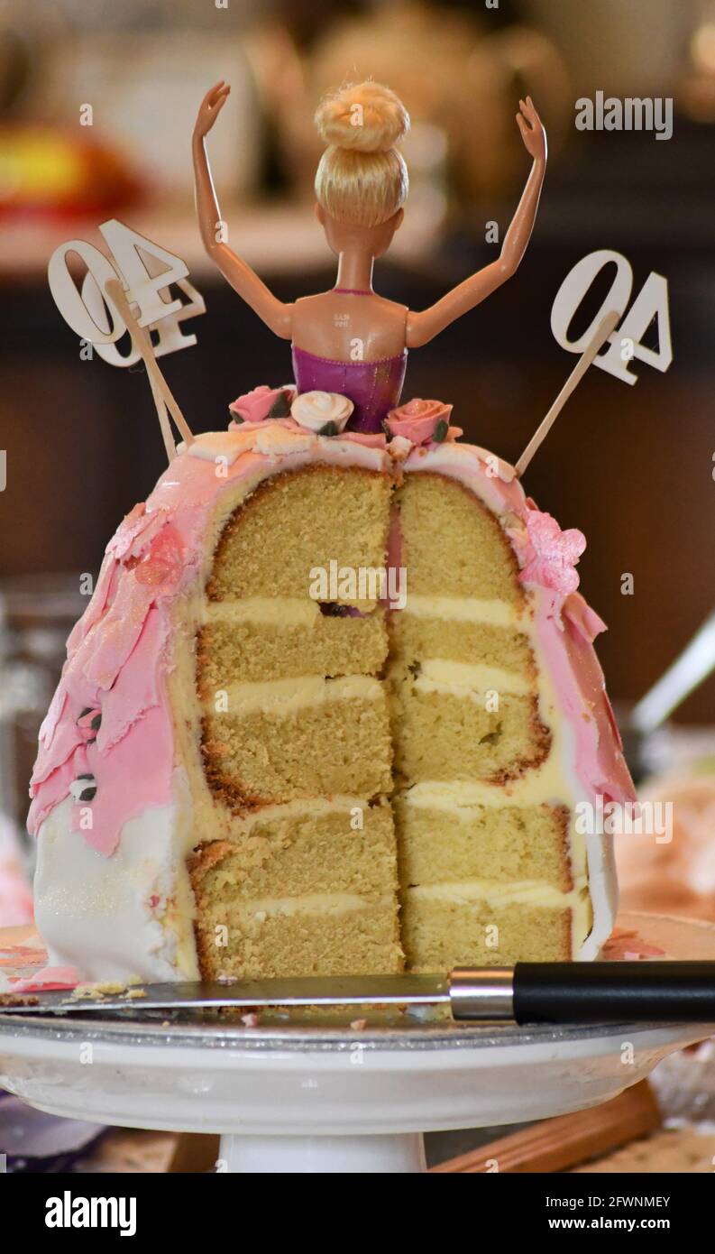 40th Barbie birthday cake sliced from the rear Stock Photo - Alamy