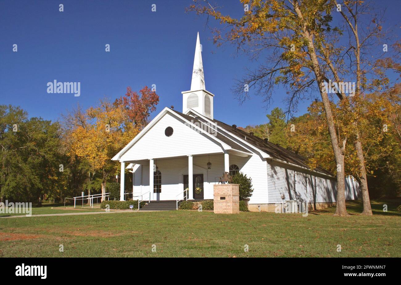 Rural Church in Autumn. White Church with golden leaves Stock Photo - Alamy