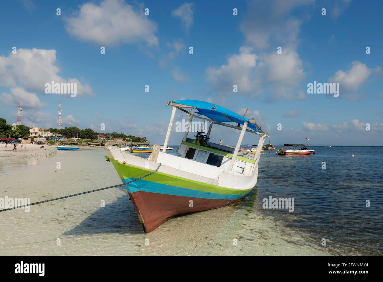 Traditional wooden boat moored on beautiful white sand Bira Beach at this  resort town in the far South; Tanjung Bira, South Sulawesi, Indonesia Stock  Photo - Alamy