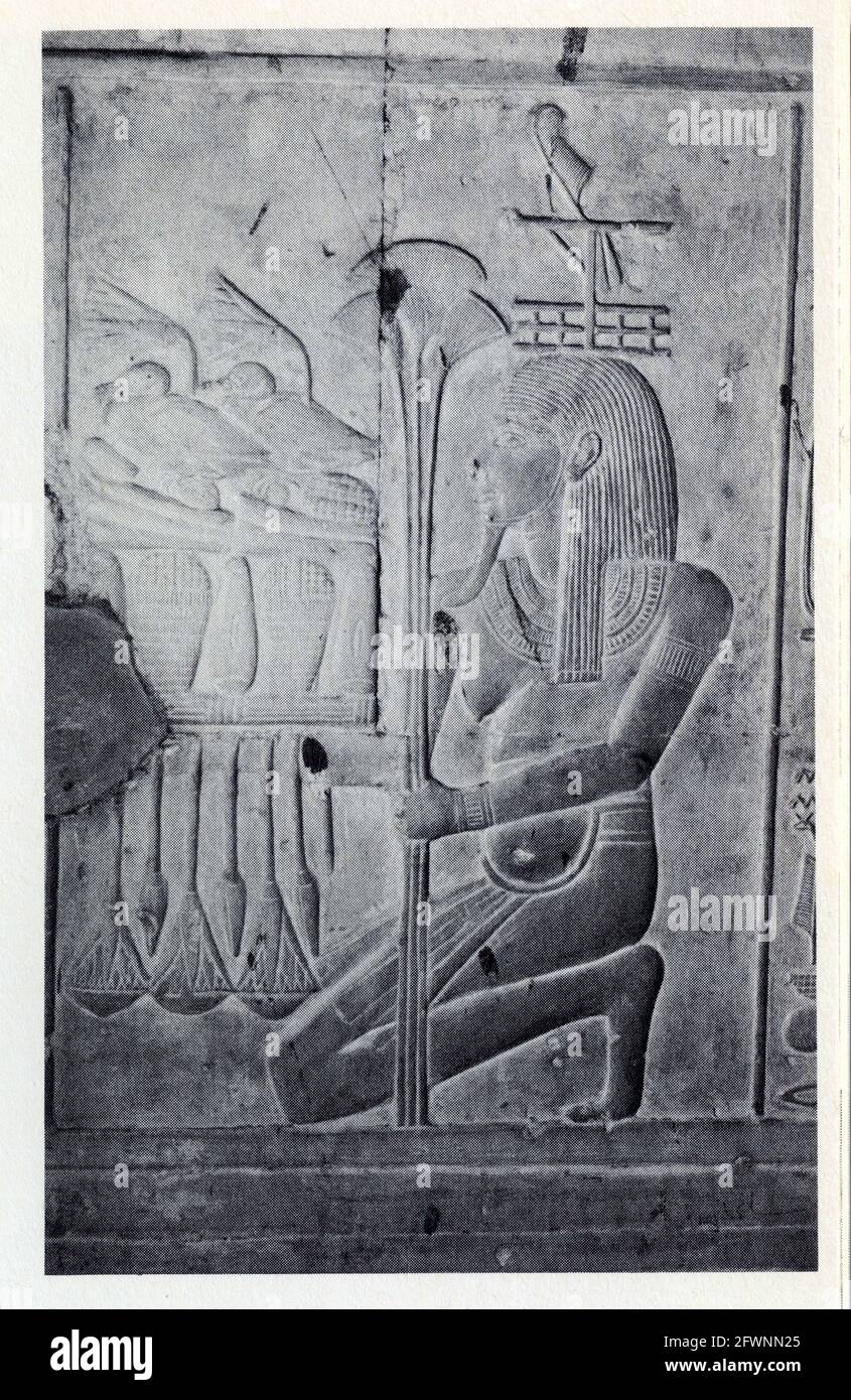 Relief of the Nile god Hapi shown kneeling holding an offering table loaded with fruit and ducks.XIX Dynasty.1310 BC.Temple of Seti I,Abydos. Stock Photo
