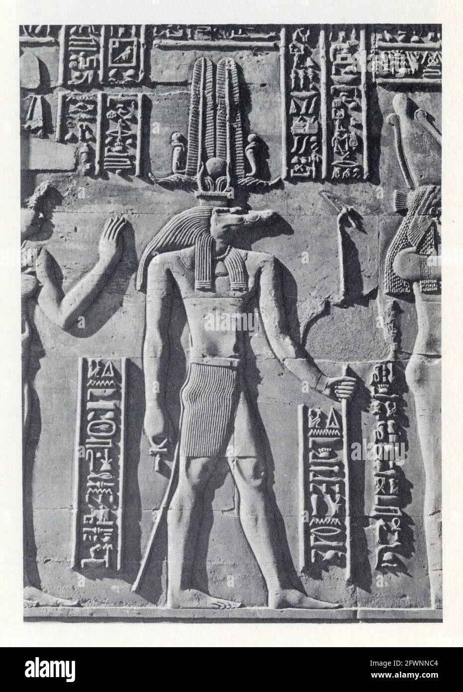 The crocodile god Suchos was especially revered at the Ptolemaic temple of Kom Ombo.He appears frequently in high relief wearing an atef crown and car Stock Photo
