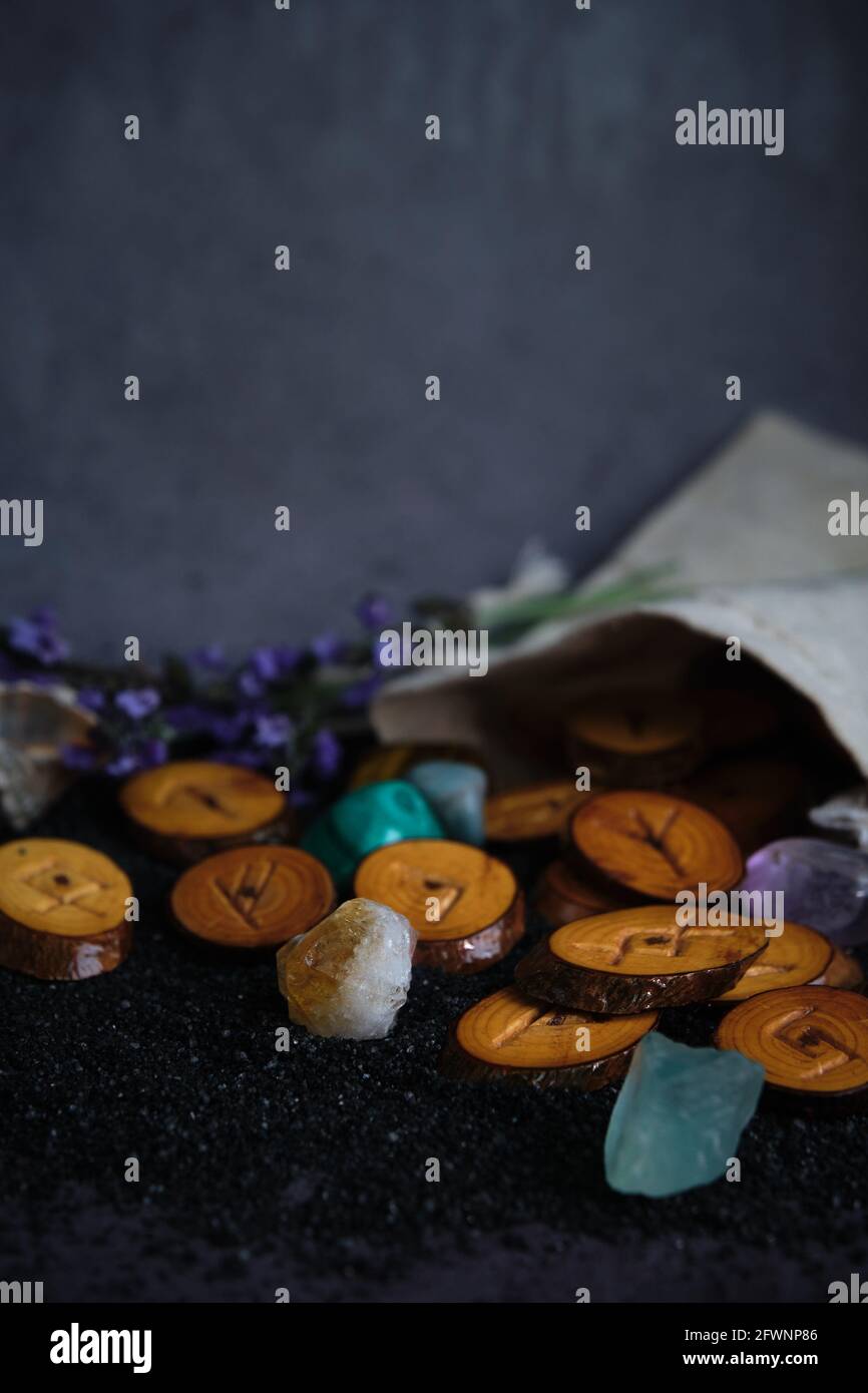 homemade wooden runes on a dark background Stock Photo - Alamy