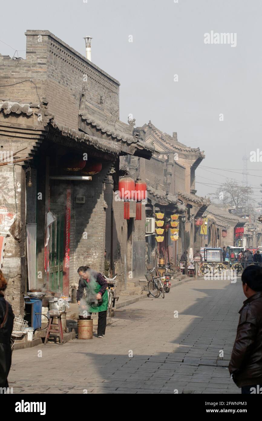 Vertical shot of a Dumpling street vendor, Pingyao Old City, Shanxi Province, China 8th November 2012 Stock Photo