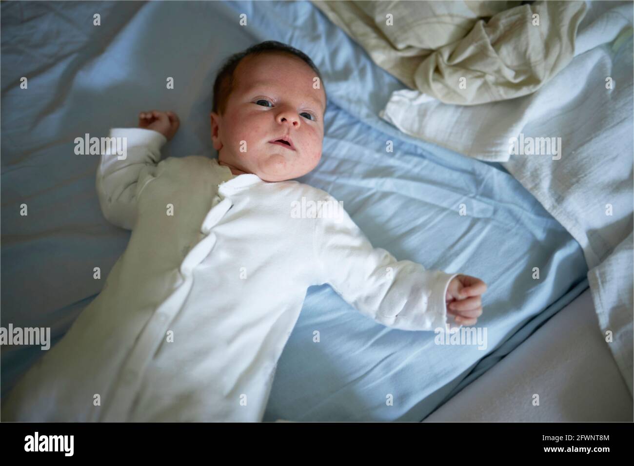 Baby in a bed Stock Photo
