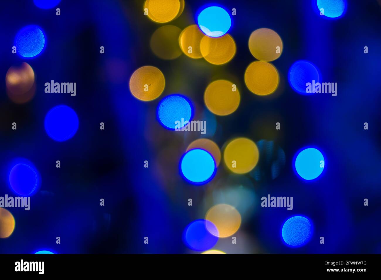 Defocused ligths of blue Christmas tree background Stock Photo - Alamy