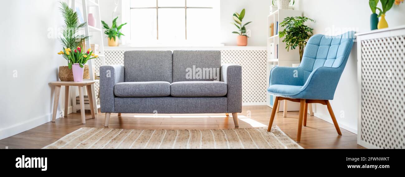 Living room with white walls and colourful furniture. Stock Photo