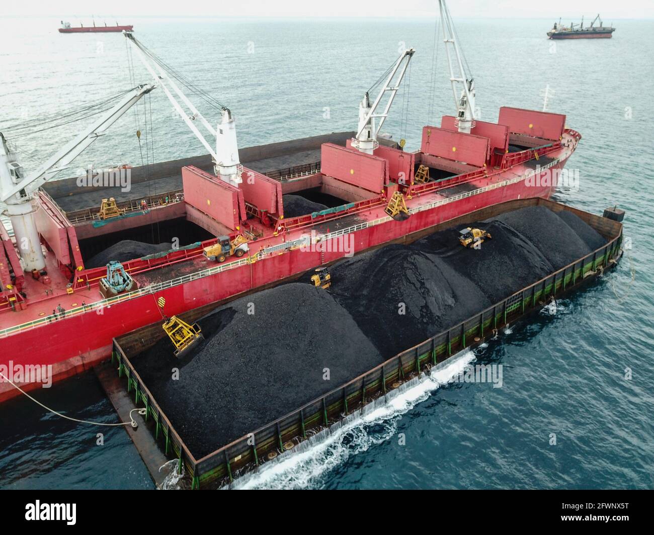 Aerial and assisting barge boat boating cargo carrying coal crane hi