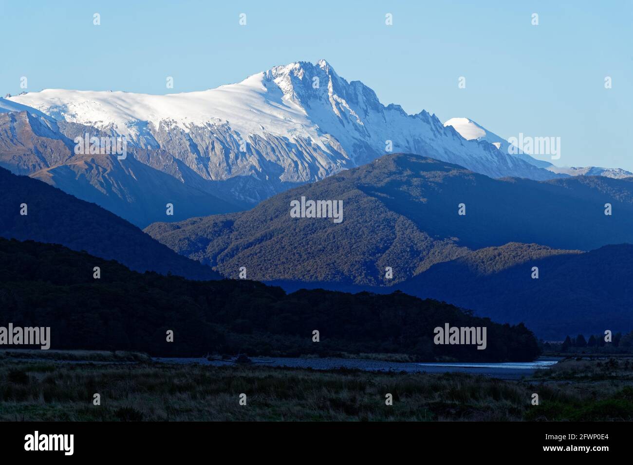 Snow has fallen on the mountain tops, covering them with a white blanket Stock Photo Alamy