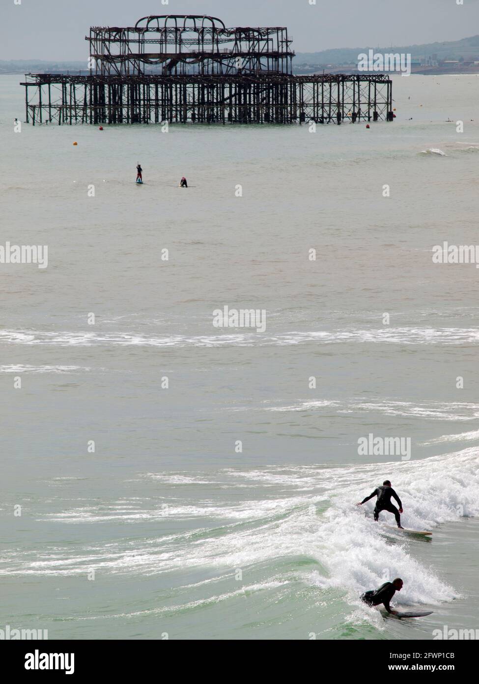 Surfing near the West Pier at Brighton Stock Photo Alamy