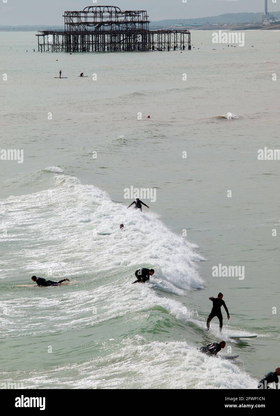 Surfing near the West Pier at Brighton Stock Photo Alamy