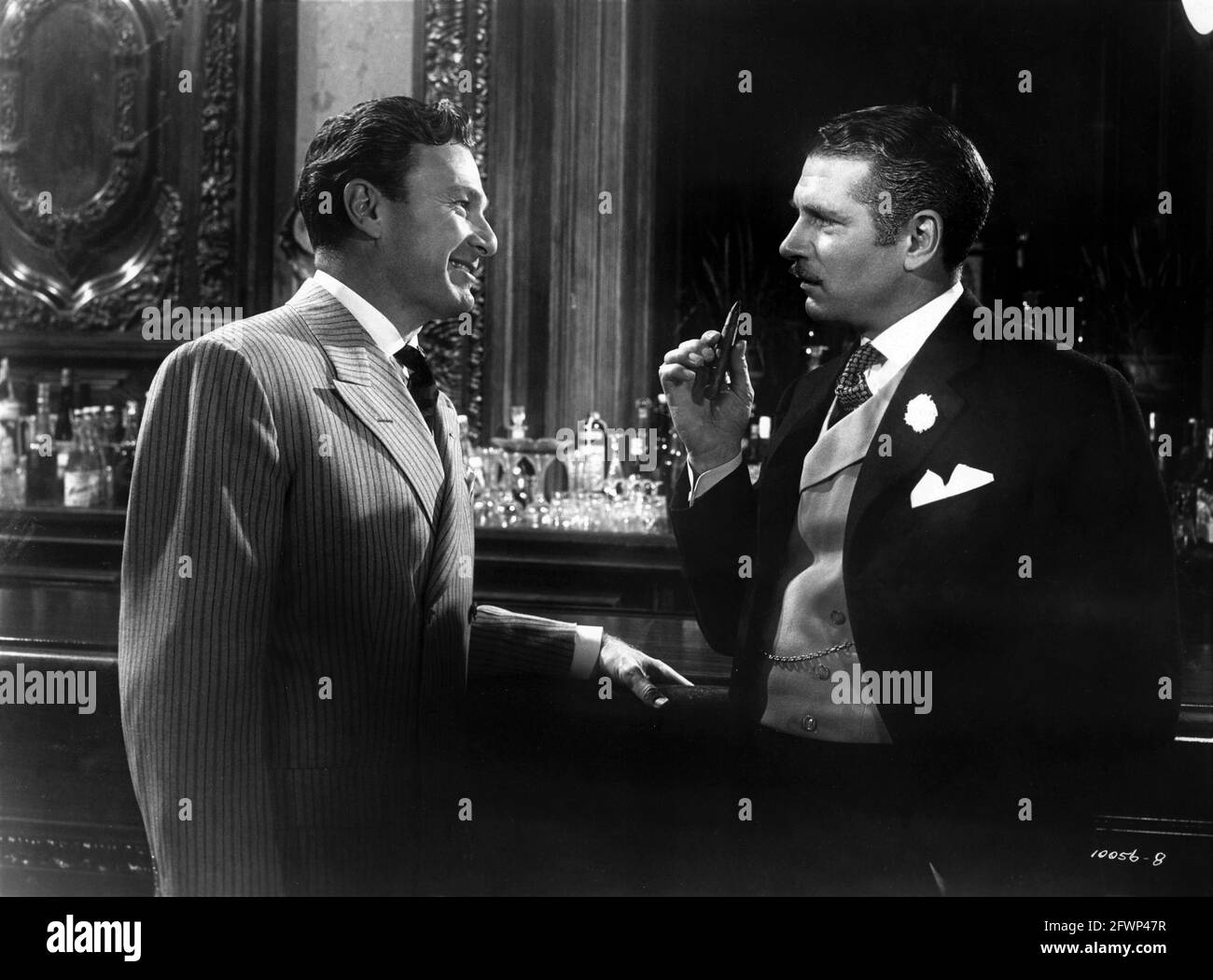 EDDIE ALBERT and LAURENCE OLIVIER in CARRIE 1952 director WILLIAM WYLER from the novel Sister Carrie by Theodore Dreiser screenplay Ruth and Augustus Goetz music David Raksin costume design Edith Head Paramount Pictures Stock Photo