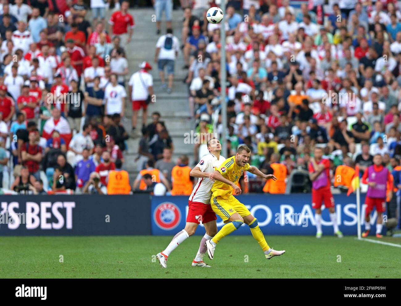 MARSEILLE, FRANCE - JUNE 21, 2016: Andriy Yarmolenko of Ukraine (in Yellow) fights for a ball with Artur Jedrzejczyk of Poland during their UEFA EURO 2016 game at Stade Velodrome in Marseille Stock Photo