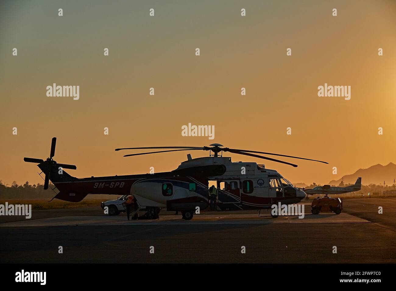 Flight Line in Dili International Airport, at sunrise. Stock Photo