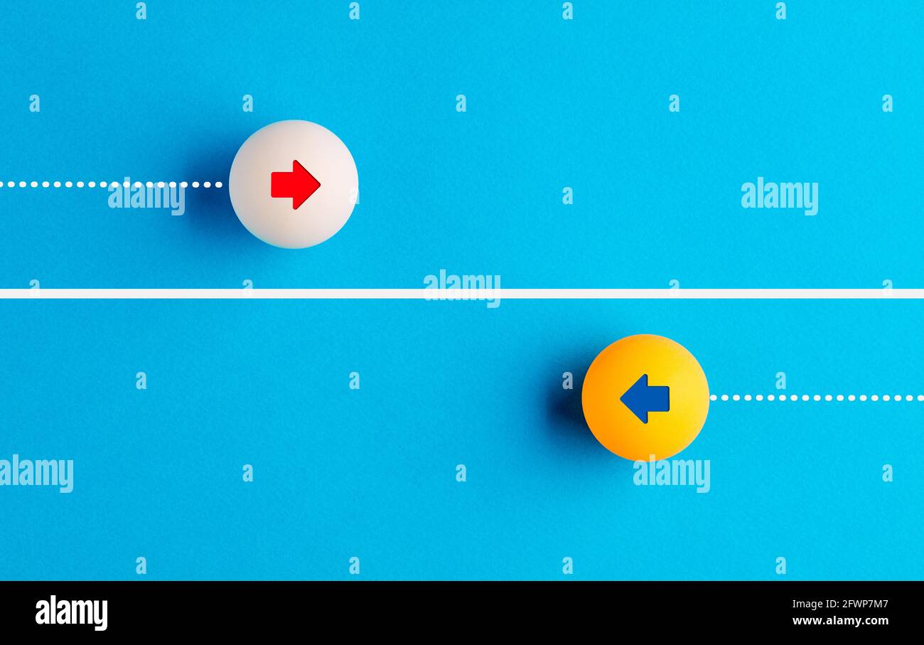 Arrow icons in contrast on table tennis balls moving towards opposite directions. Competition, diversity, opposition or confrontation concept. Stock Photo