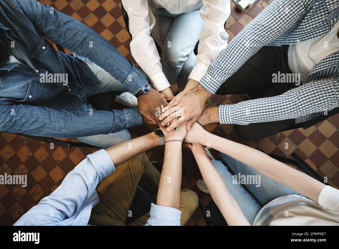 Top view of diverse people hands holding together in circle, hands ...