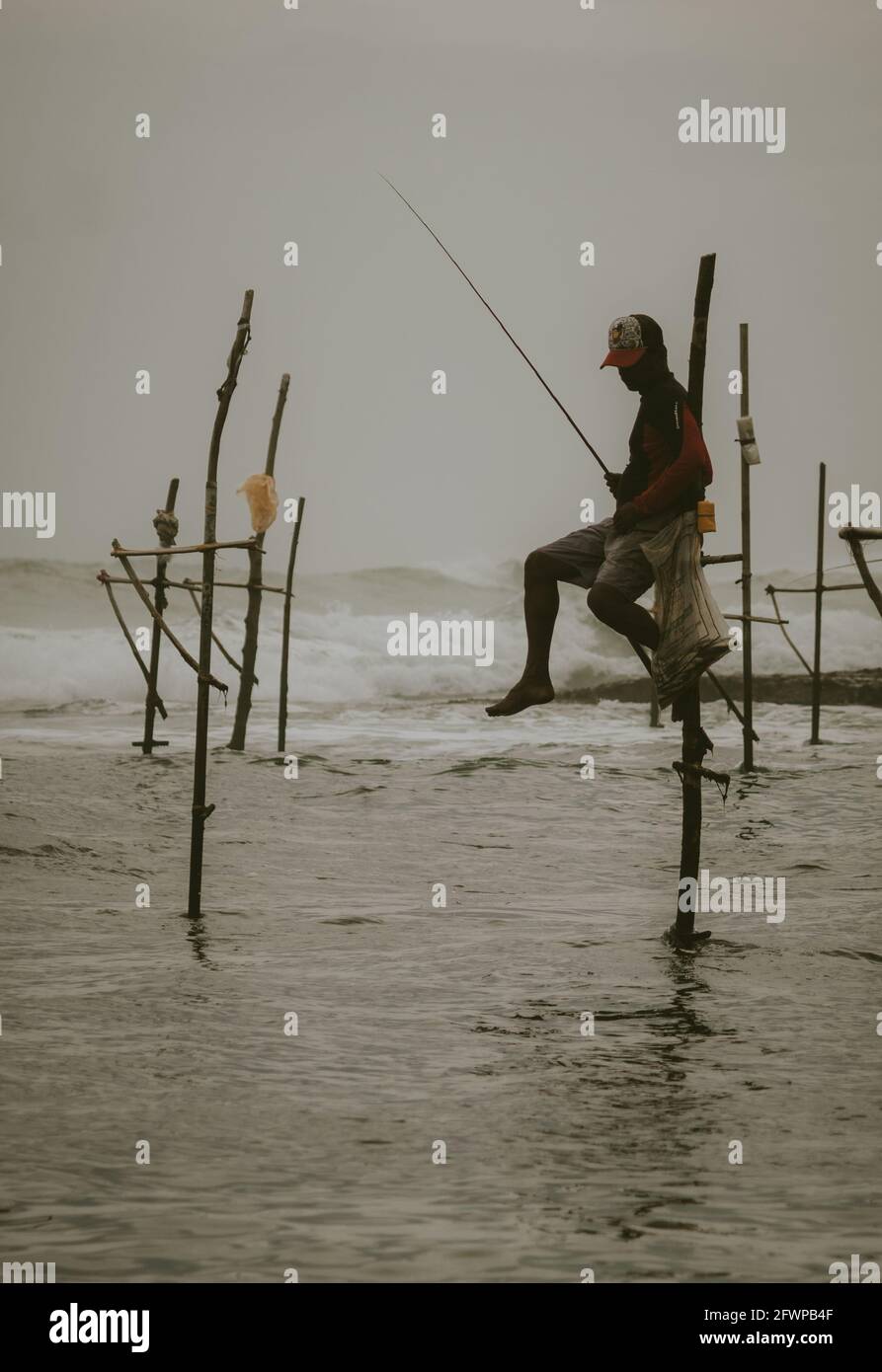 Stick fisherman hi-res stock photography and images - Alamy