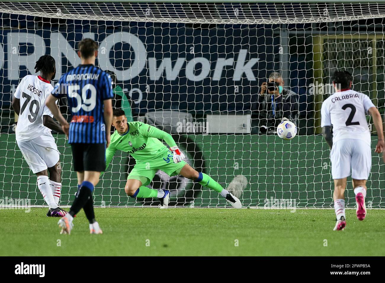 BERGAMO, ITALY - MAY 23: Franck Kessie of AC Milan scores his sides second goal from the penalty spot past goalkeeper Pierluigi Gollini of Atalanta BC Stock Photo
