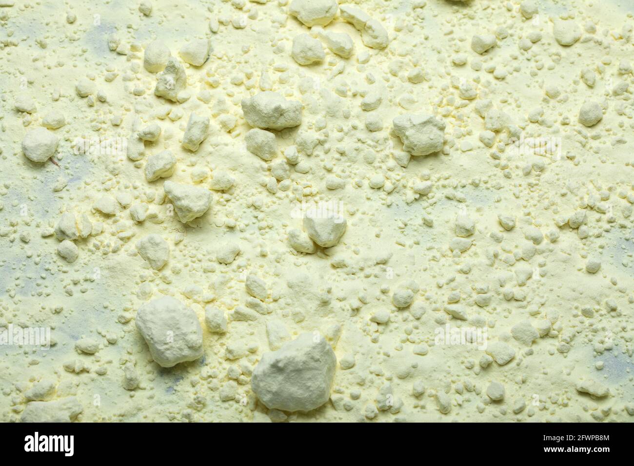 Powdered sulphur, a chemical element. Yellow background Stock Photo Alamy