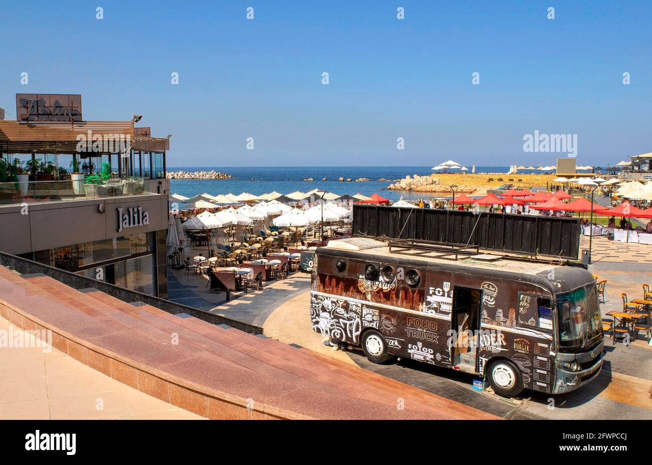 Alexandria - Egypt - October 08, 2020: Beachfront of Alexandria touristic city. Sealine with cafes during the daytime. Mediterranean sea in Alexandria Stock Photo