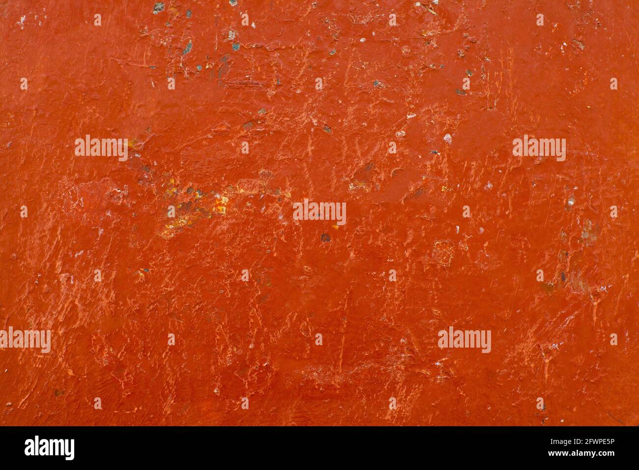 Old red dirty grunge painted stucco wall background Stock Photo