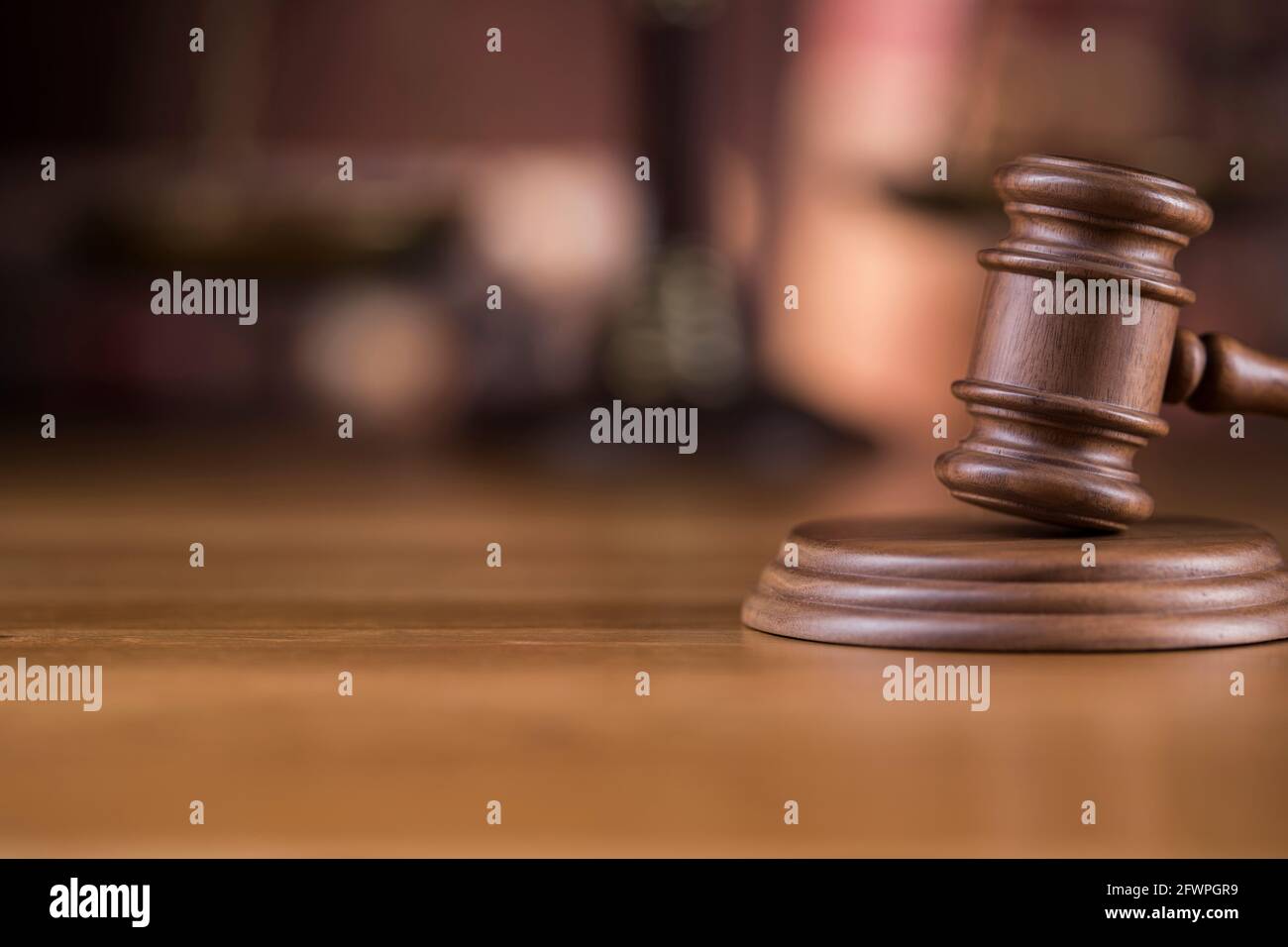 Law theme, mallet of judge, wooden gavel, globe background Stock Photo