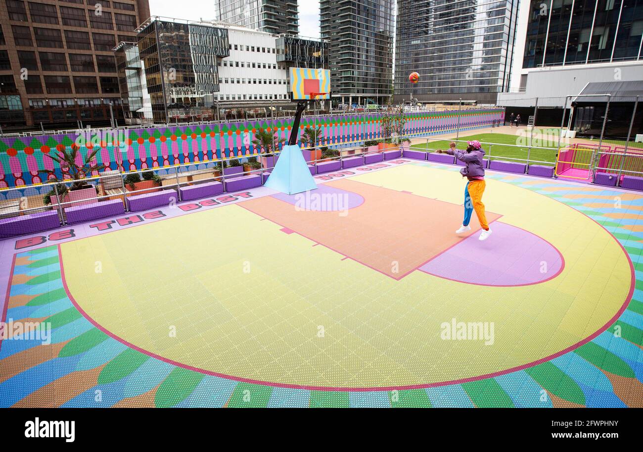 EDITORIAL USE ONLY British-Nigerian artist, Yinka Ilori unveils an outdoor  public basketball court, which he has designed, at Bank Street Park in  Canary Wharf, London. Picture Date: Monday May 24, 2021 Stock