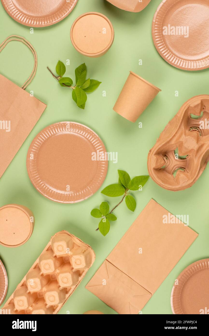 Flat lay composition with eco-friendly tableware and kraft paper food ...