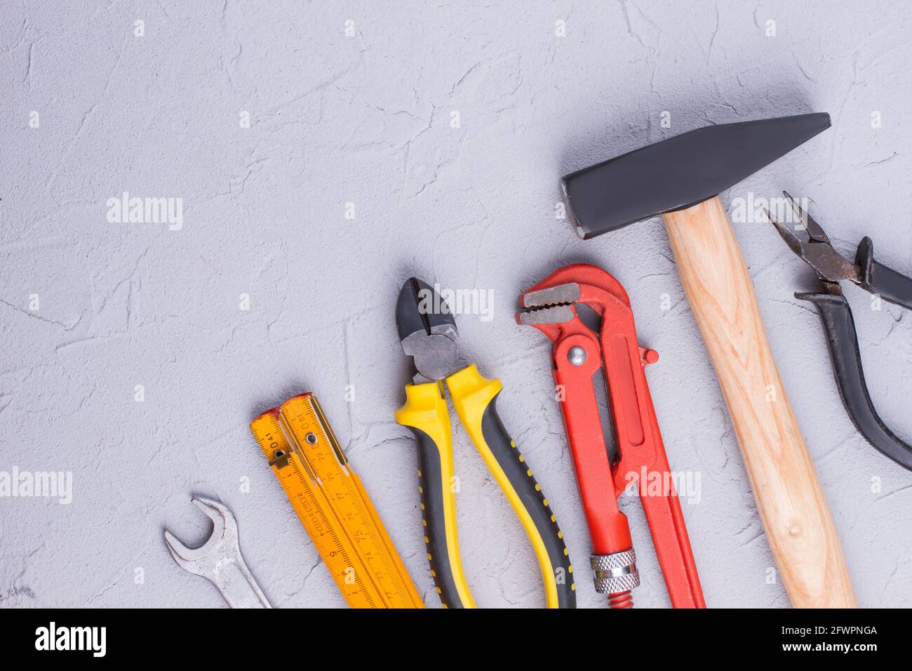 Set of construction tools on gray background Stock Photo - Alamy