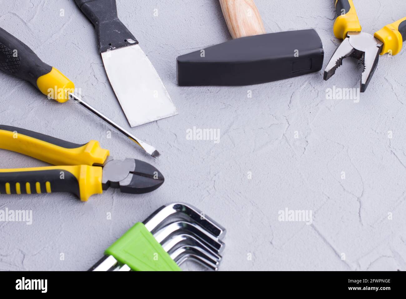 Different construction tools on gray background Stock Photo Alamy