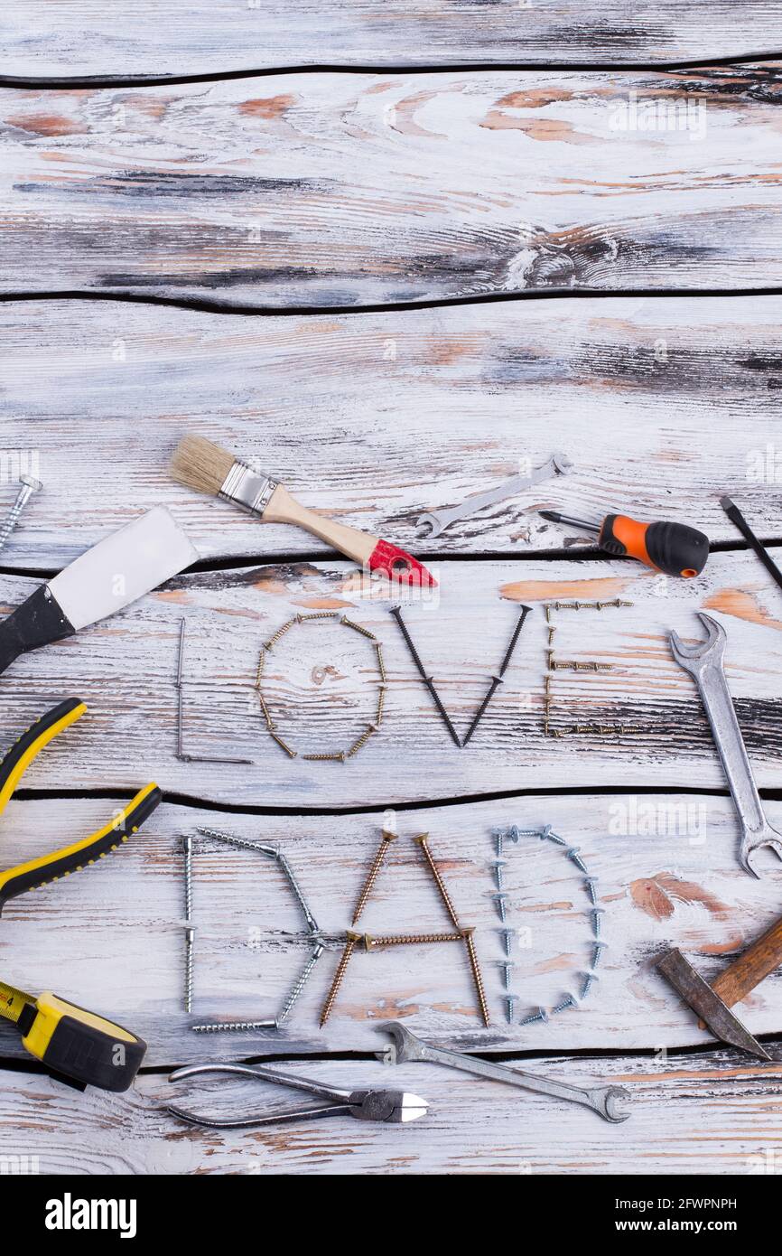 Flat lay composition with construction tools on wooden background. Stock Photo