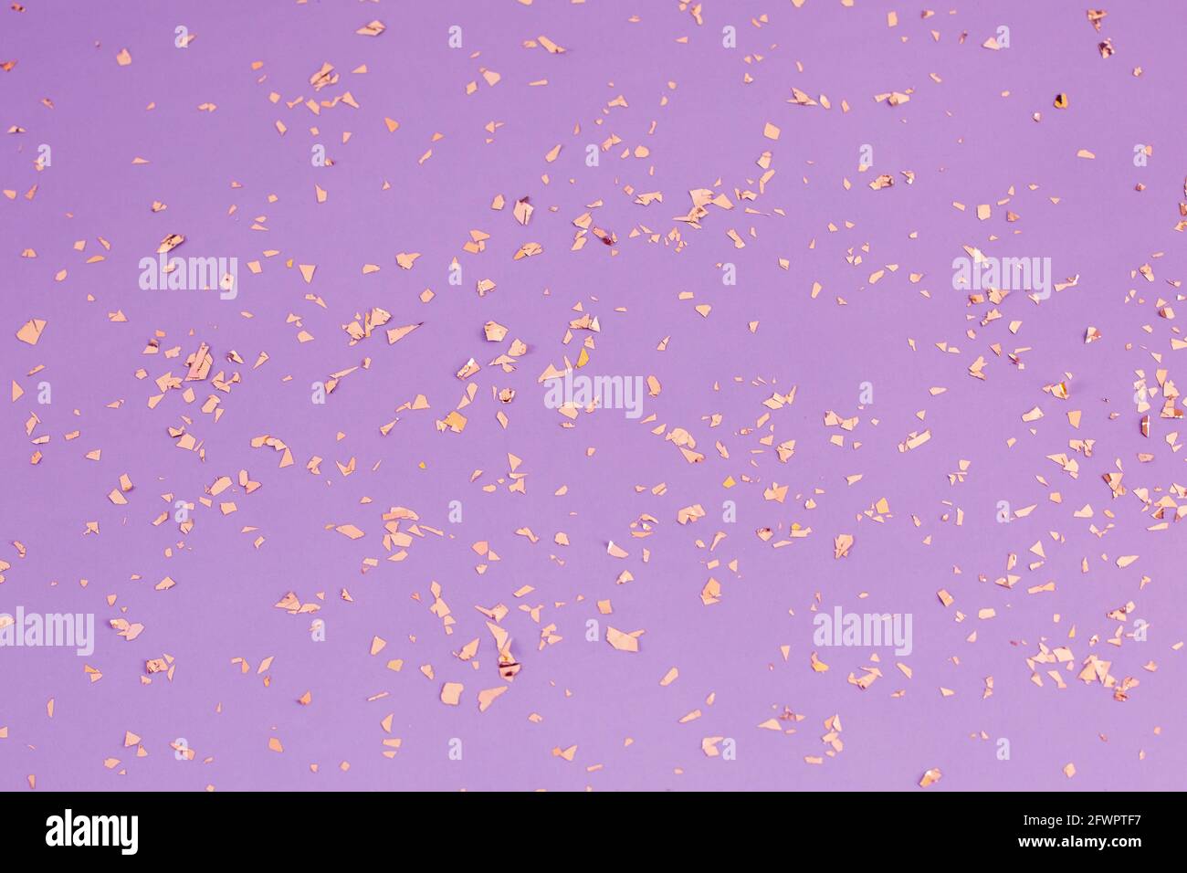 Falling golden glitter confetti isolated on white background. Shiny  particles. Stock Photo by kasiopeja999
