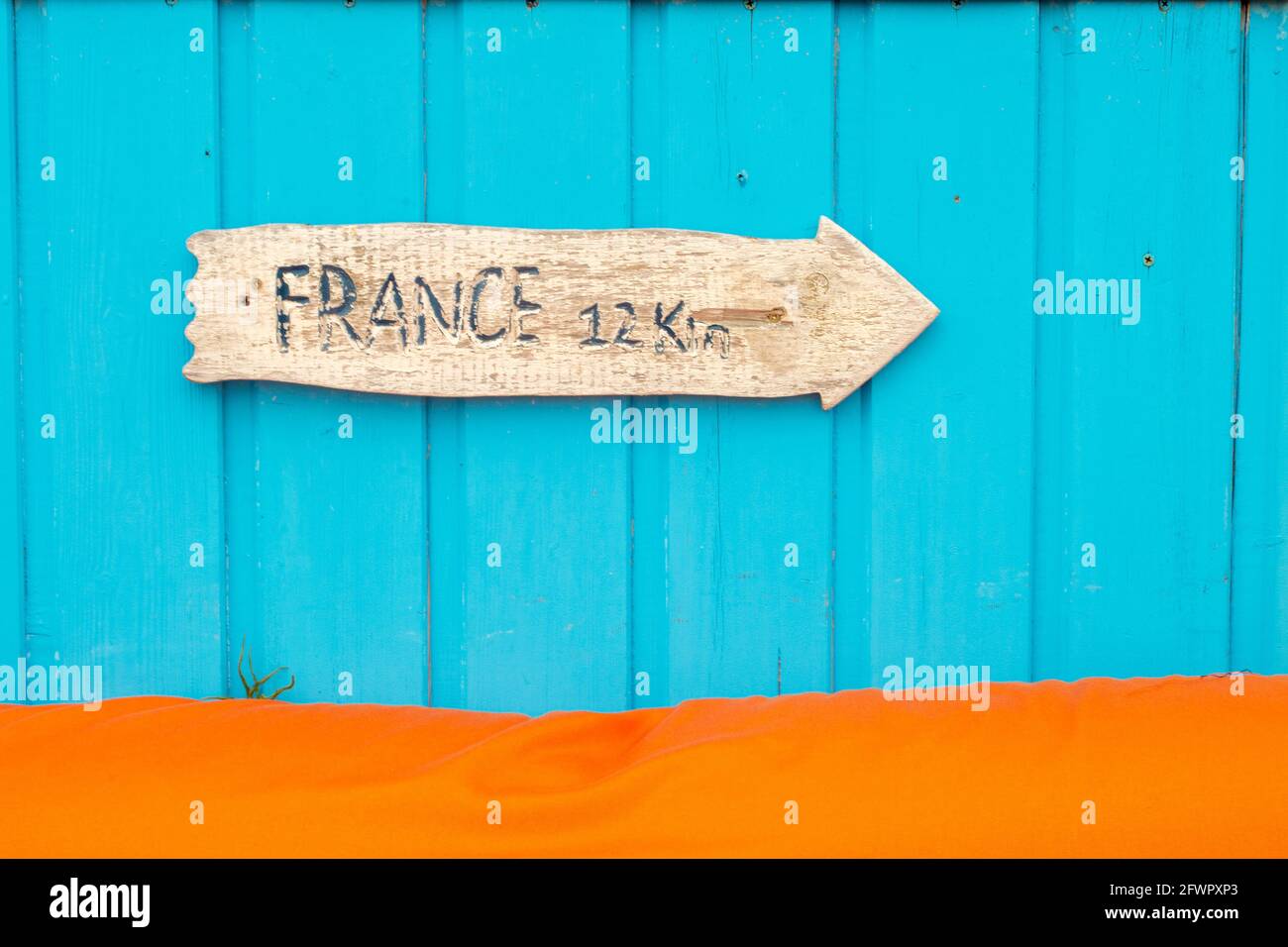 Arrow shaped sign France 12Km on wooden oyster farming hut at Oleron ...