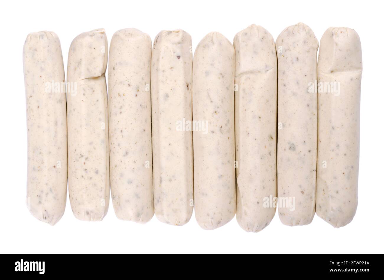 Vegetarian barbecue sausages, in a row, from above, isolated, over white. Meatless white sausages made from egg and milk protein as a meat substitute. Stock Photo