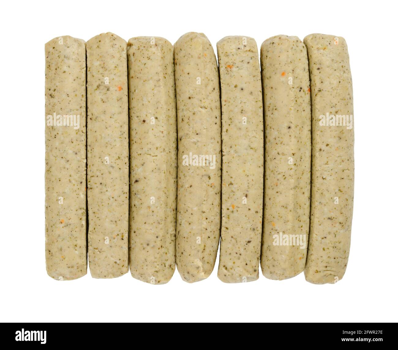 Vegan Bratwurst sausages, in a row, from above, isolated, over white. Group of Franconian sausages, a variety of German bratwurst, made of saitan. Stock Photo