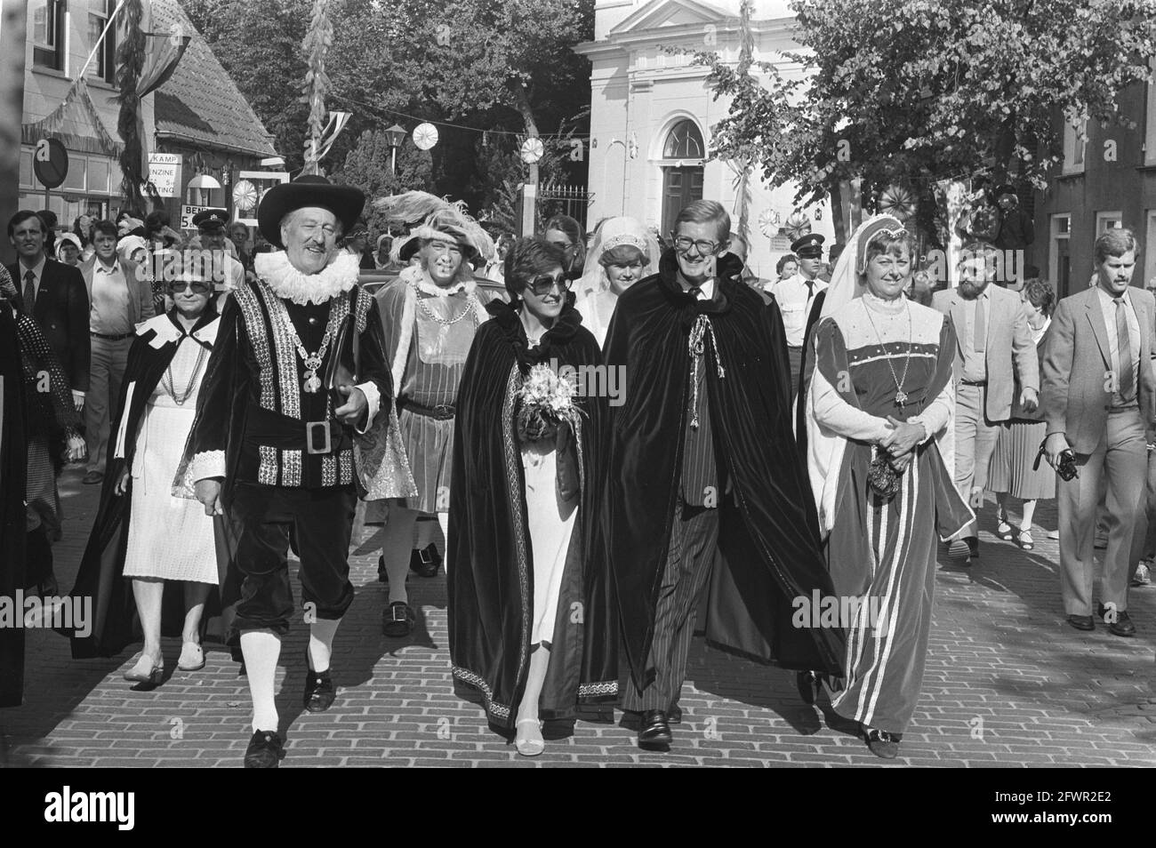 Princess Margriet and Mr. Van Vollenhoven, both wearing medieval capes, walk through the village of Ooltgensplaat during the celebration of the 500th anniversary of St. Adolphus, September 5, 1981, municipalities, anniversaries, parades, princesses, The Netherlands, 20th century press agency photo, news to remember, documentary, historic photography 1945-1990, visual stories, human history of the Twentieth Century, capturing moments in time Stock Photo