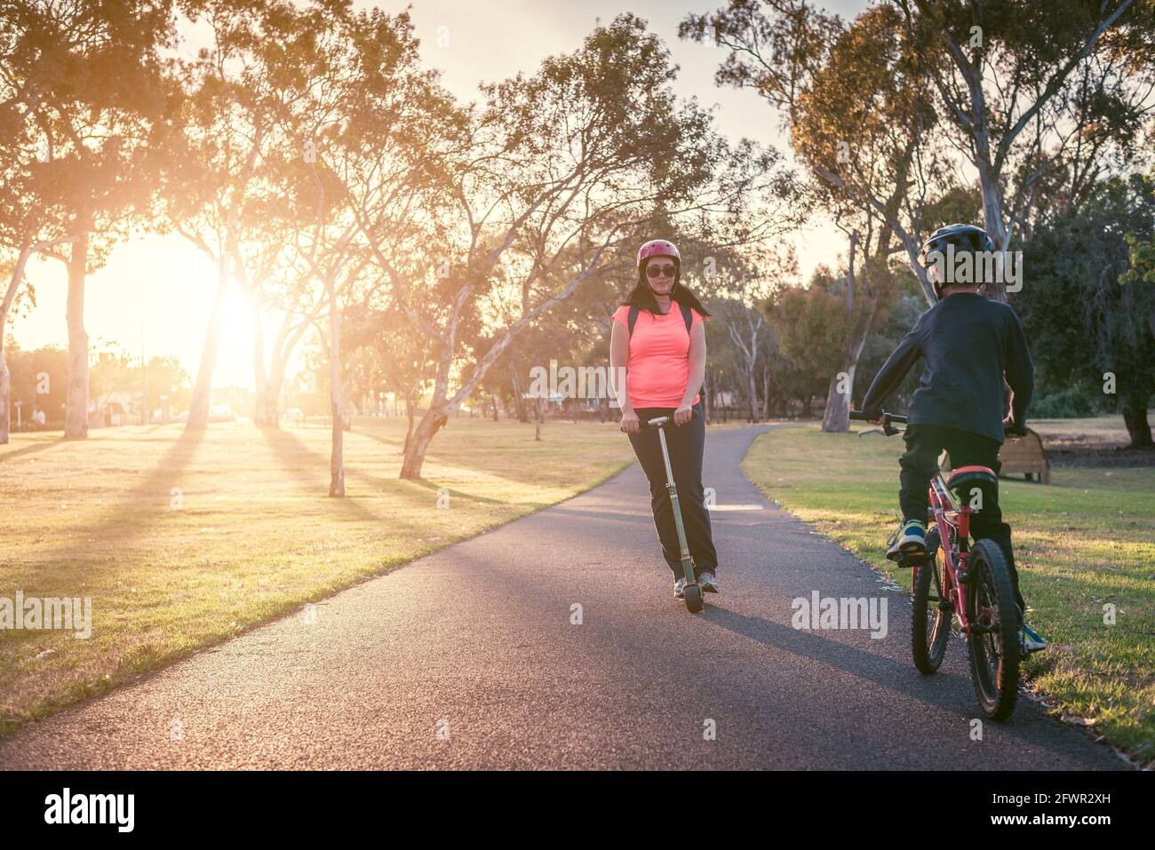 Mother with her son riding  in Adelaide Park Lands Stock Photo
