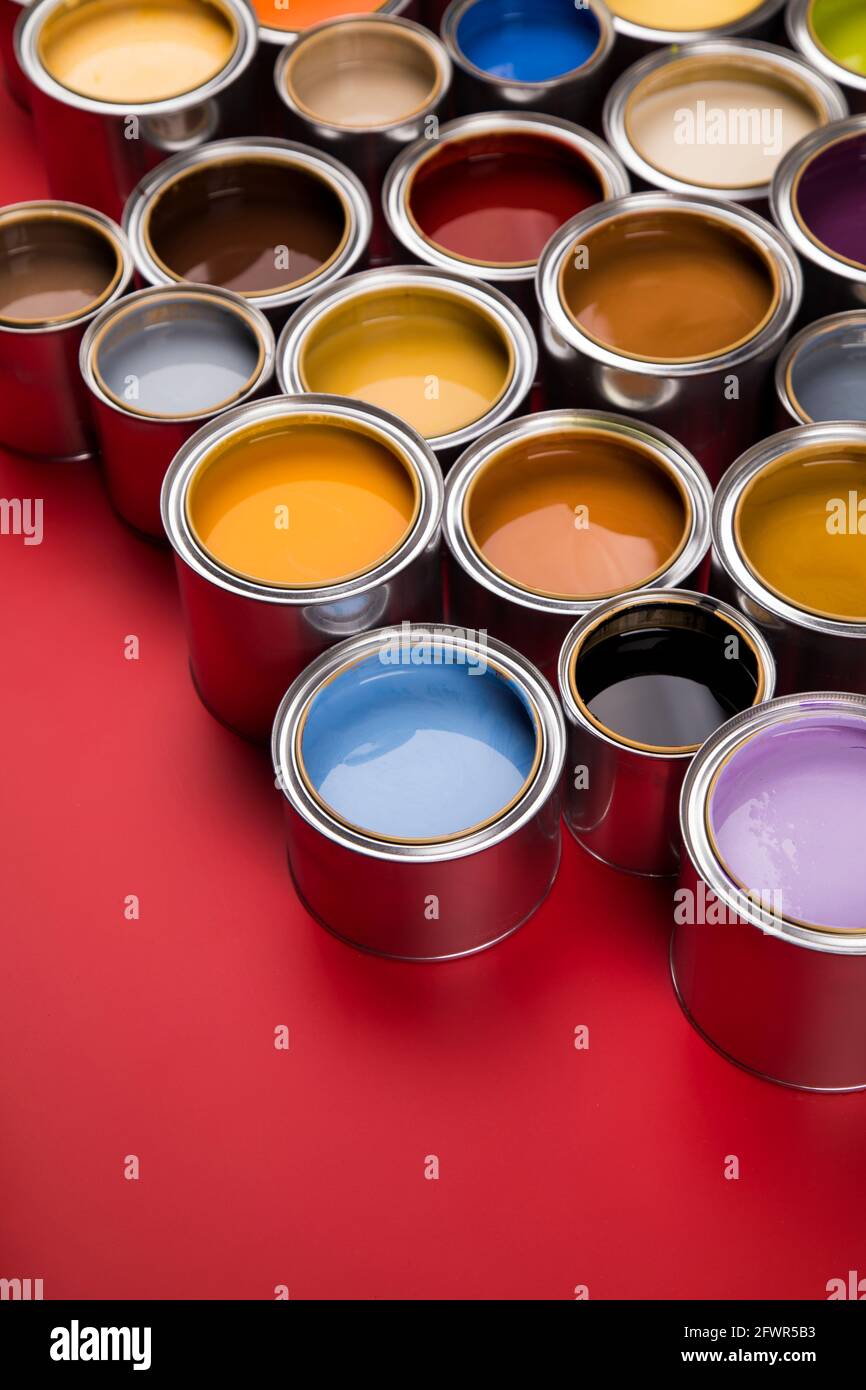 Group of tin metal cans with color paint Stock Photo - Alamy