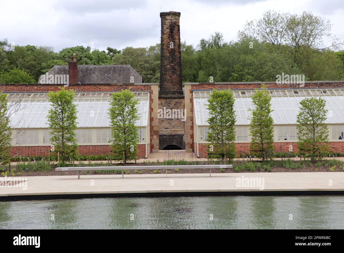 Victorian Chimney and Greenhouses Stock Photo