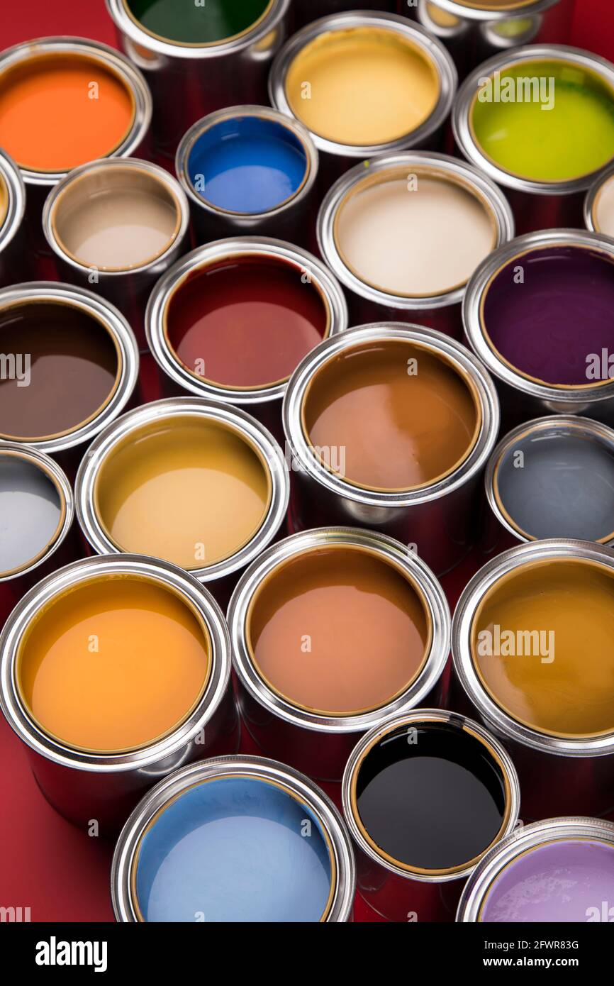 Group of tin metal cans with color paint Stock Photo - Alamy