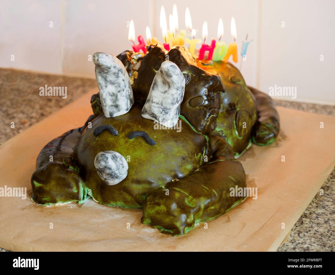 Kid's homemade dinosaur birthday cake, UK Stock Photo