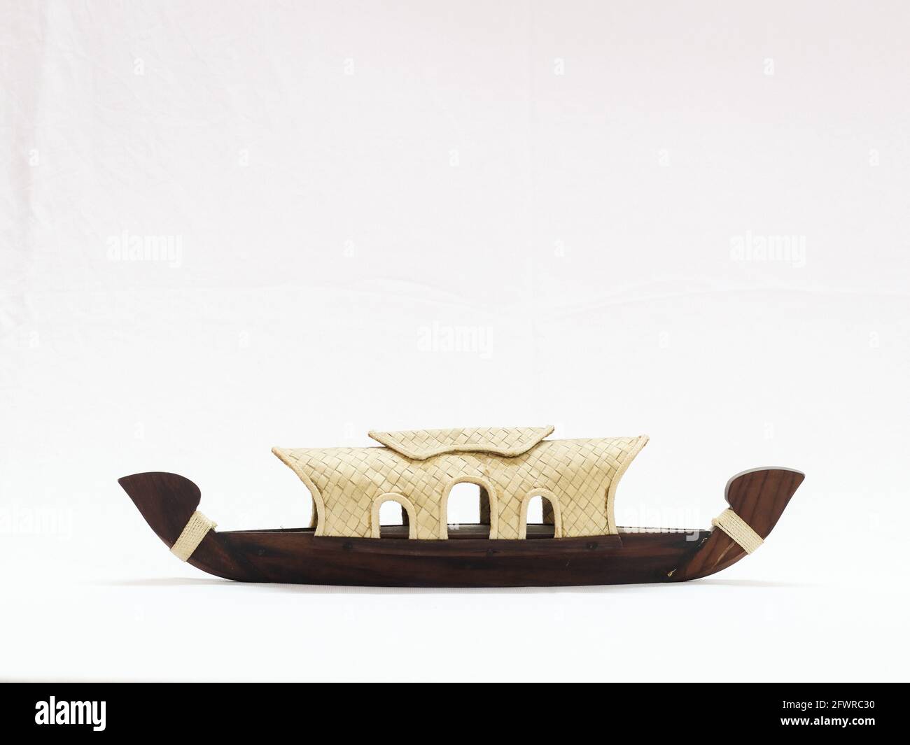 miniature kerala houseboat toy isolated in a white background Stock Photo