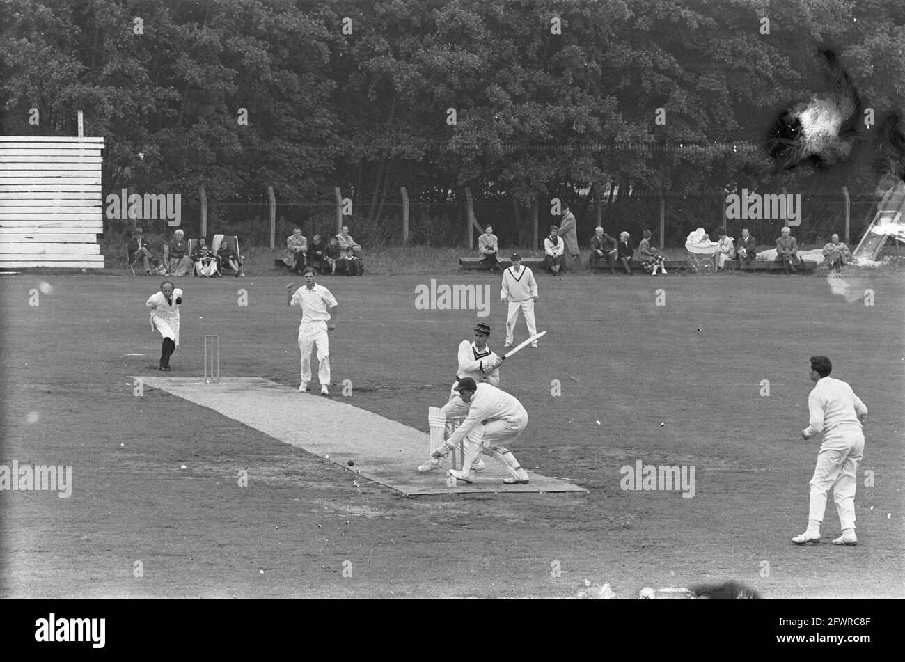 Cricket Red and White against HBS in Haarlem. Batsman Ruud Onstein of Rood en Wit manages to hit the ball, 7 July 1963, CRICKET, The Netherlands, 20th century press agency photo, news to remember, documentary, historic photography 1945-1990, visual stories, human history of the Twentieth Century, capturing moments in time Stock Photo