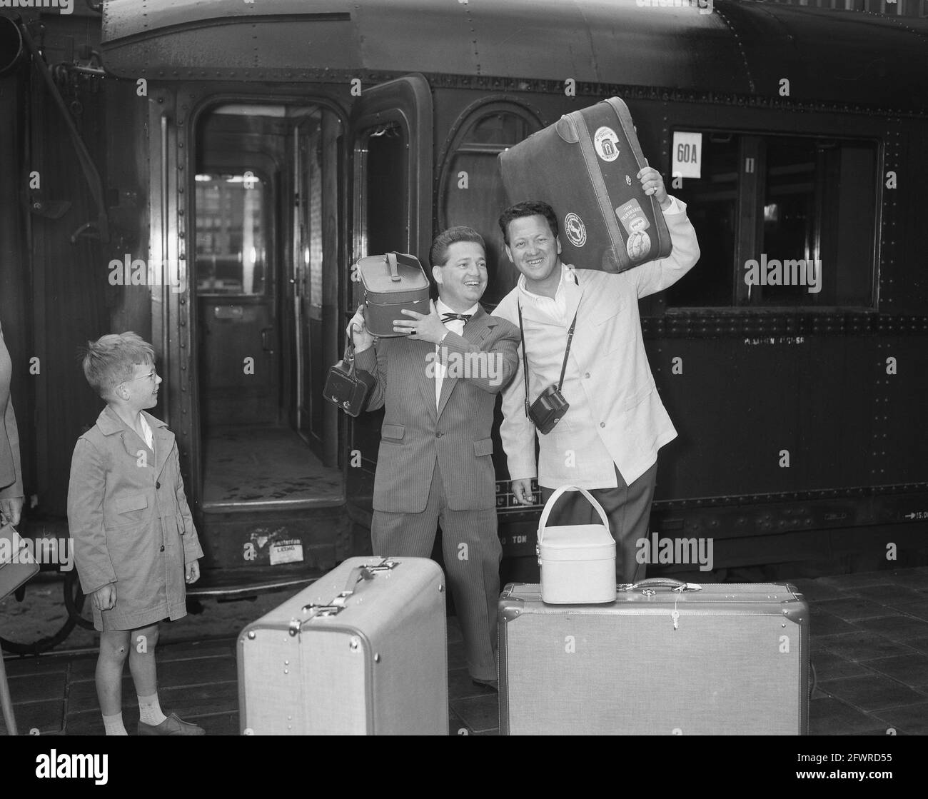 Dutch artists to Singing Festival in Venice, Willy Alberti and Johnny  Jordaan pose with their luggage at Amsterdam Central Station, June 25,  1957, artists, song festivals, The Netherlands, 20th century press agency