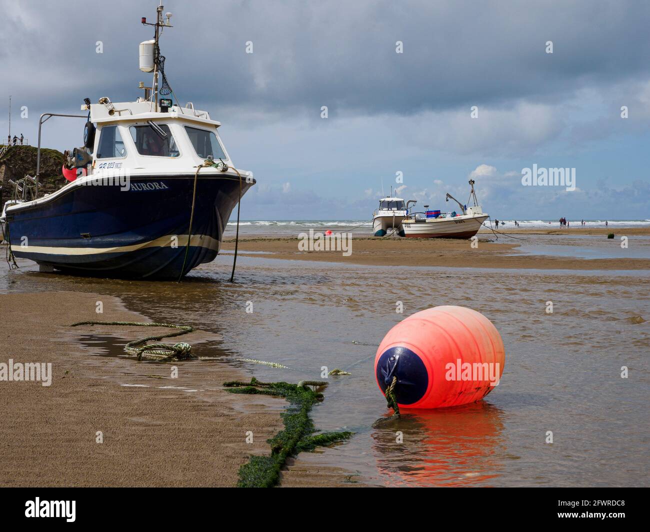 Fishing boats in Bude tidal harbour at low tide, Bude, Cornwall, UK Stock Photo