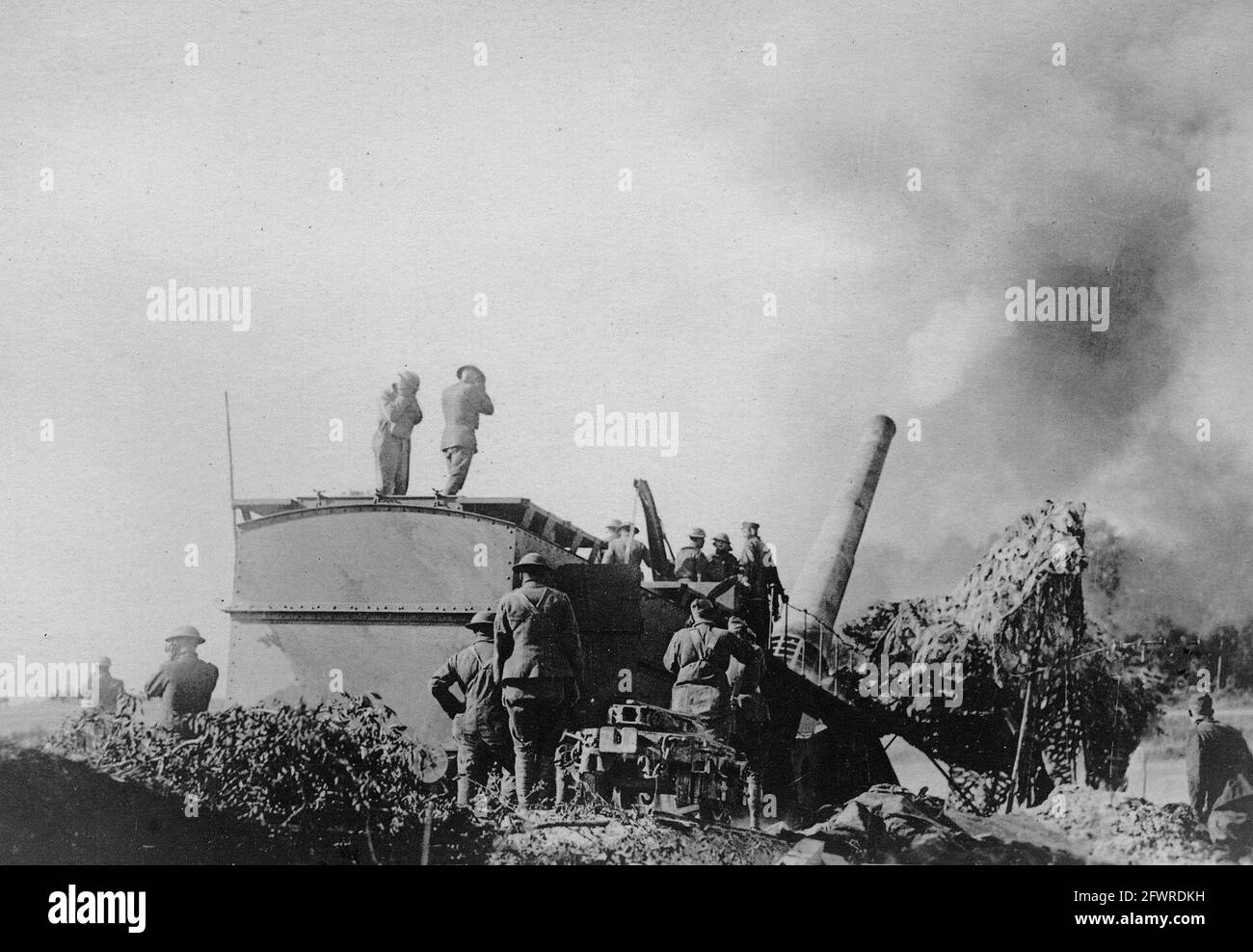 A railroad artillery gun, sending a 14 inch shell towards the enemy. These guns did much damage to the German lines of communication from 20 to 25 miles behind their lines. France, 1918. Stock Photo