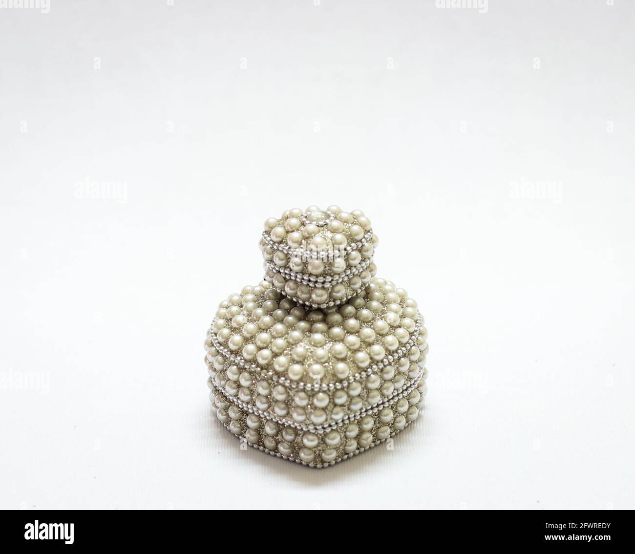 expensive antique jewelry box decorated with pearls isolated in a white background Stock Photo