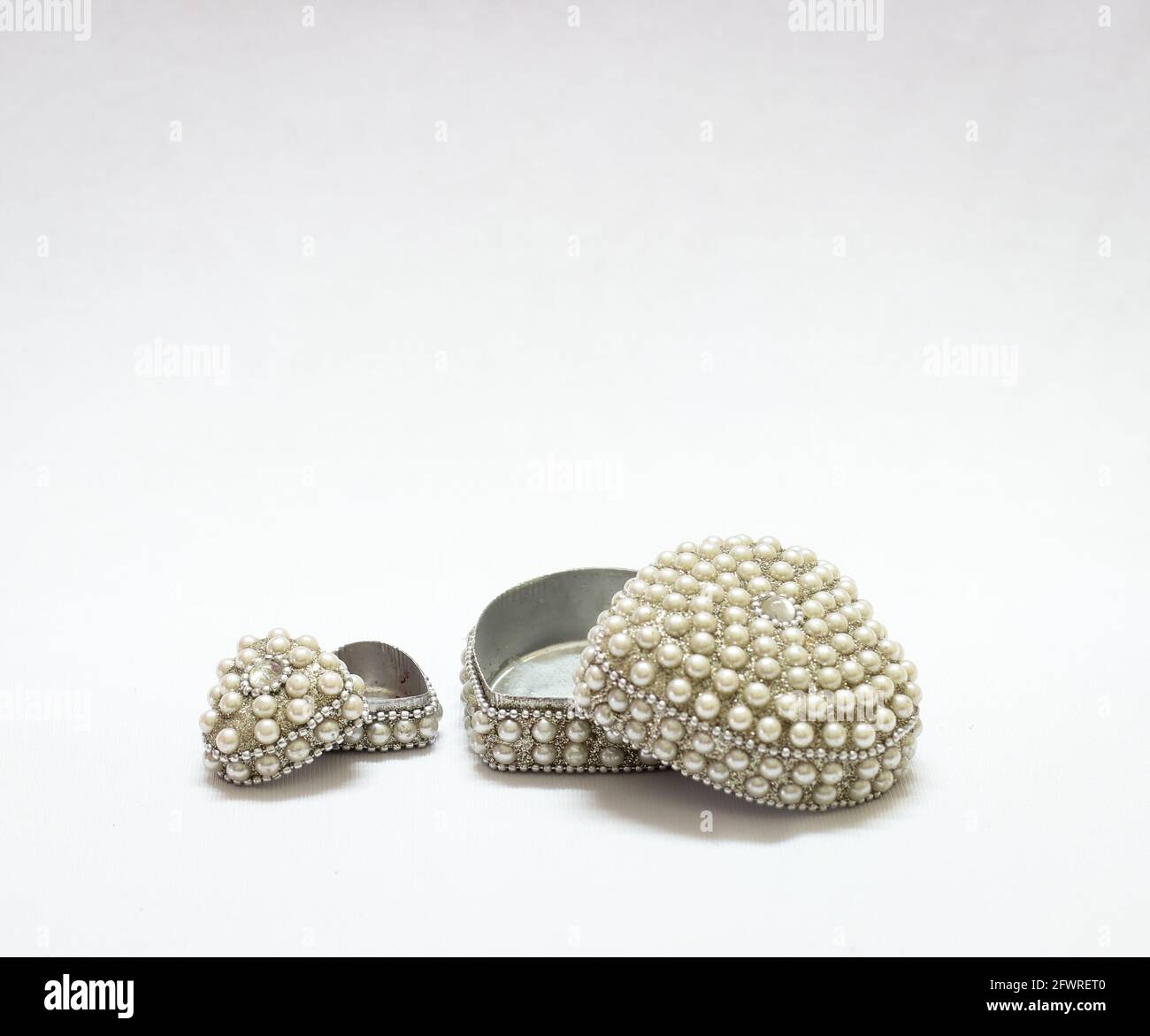 expensive antique jewelry box decorated with pearls isolated in a white background Stock Photo