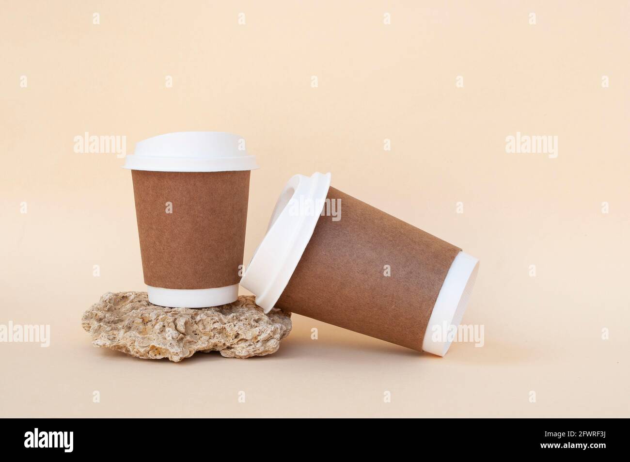 Brown sustainable paper coffee cups on a beige and orange color background.  Zero waste concept Stock Photo - Alamy, image size:1300x953