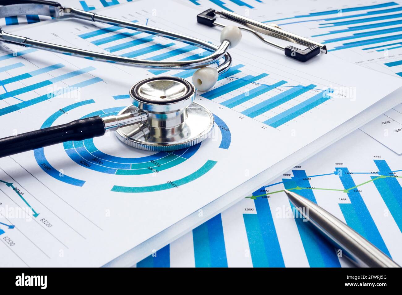 Business audit and analysis concept. Stethoscope on the financial charts. Stock Photo