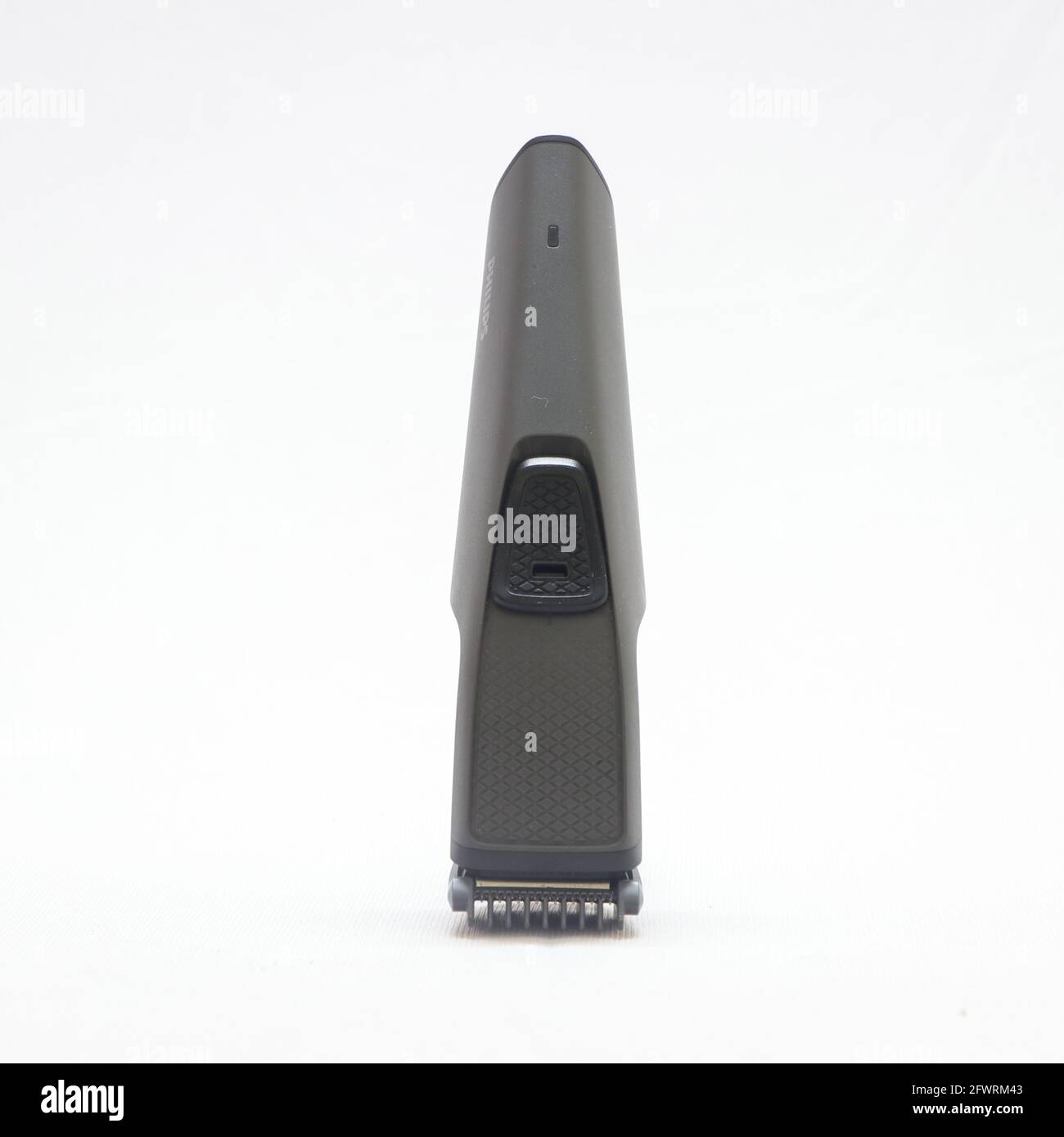 men's grey electric hair trimmer isolated in a white background Stock Photo